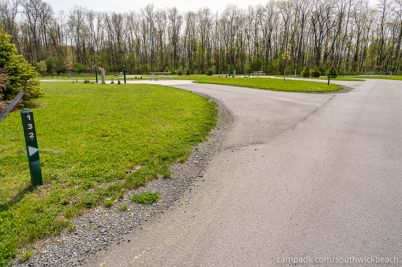 Campsite Photo of Site 132 at Southwick Beach State Park, New York - Looking at Site from Road Sign Visible