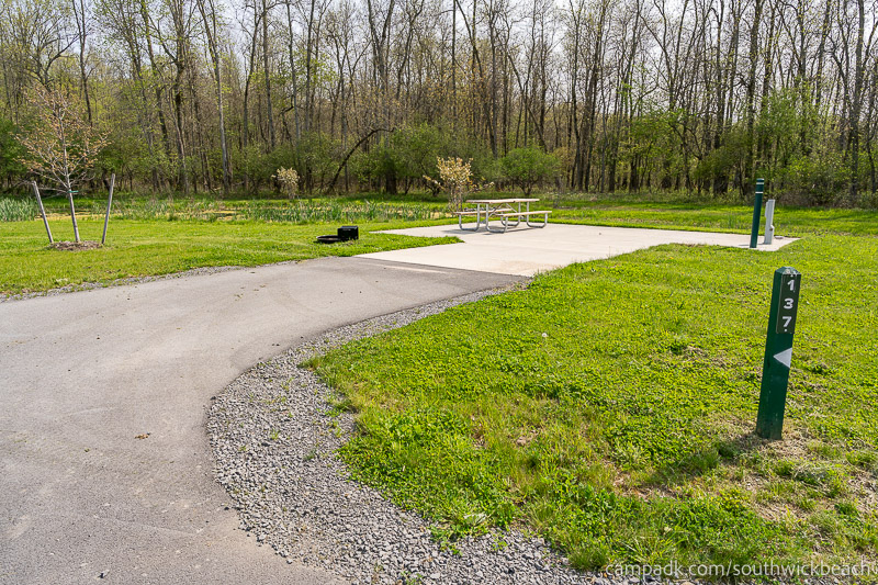 Campsite Photo of Site 137 at Southwick Beach State Park, New York - Looking at Site from Road Sign Visible