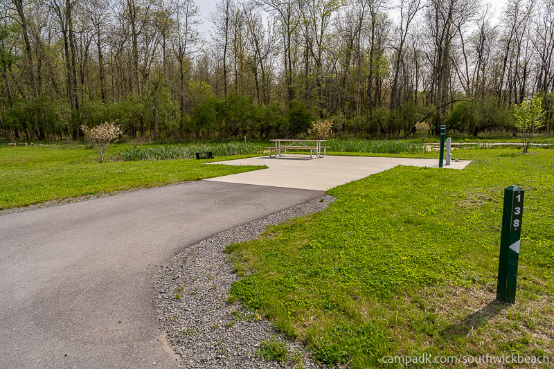 Campsite Photo of Site 138 at Southwick Beach State Park, New York - Looking at Site from Road Sign Visible