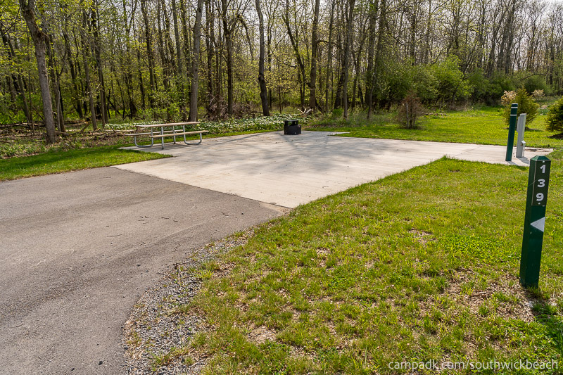 Campsite Photo of Site 139 at Southwick Beach State Park, New York - Looking at Site from Road Sign Visible