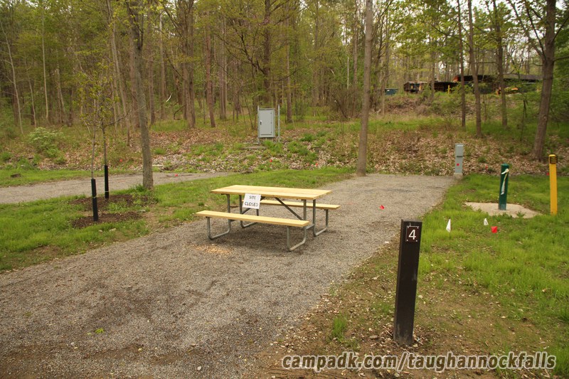 Campsite Photo of Site 4 at Taughannock Falls State Park, New York - Looking at Site from Road Sign Visible