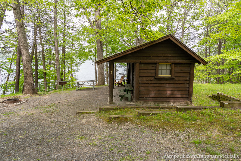 Campsite Photo of Site 2 at Taughannock Falls State Park, New York - Looking at Site from Road Sign Visible