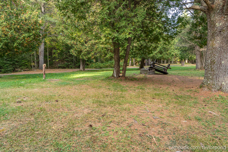 Campsite Photo of Site 23 at Taylor Pond Campground, New York - Looking at Site from Road Sign Visible