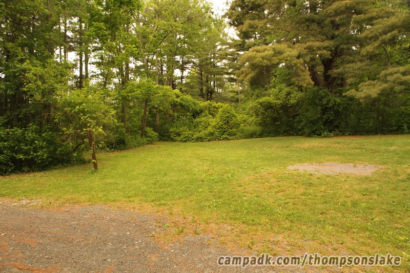Campsite Photo of Site 32 at Thompsons Lake Campground, New York - Looking at Site from Road Sign Visible