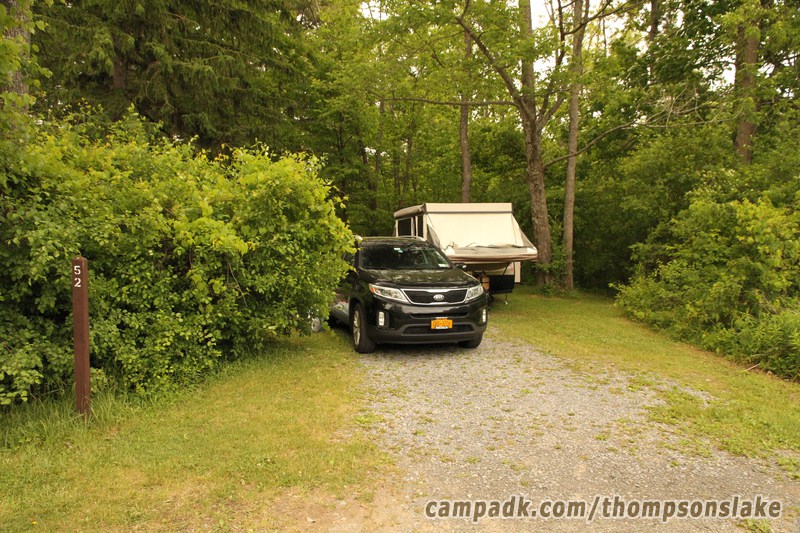 Campsite Photo of Site 52 at Thompsons Lake Campground, New York - Looking at Site from Road Sign Visible