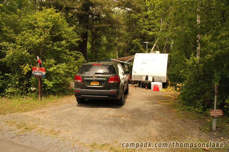 Campsite Photo of Site 67 at Thompsons Lake Campground, New York - Looking at Site from Road Sign Visible