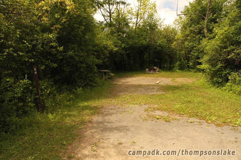 Campsite Photo of Site 84 at Thompsons Lake Campground, New York - Looking at Site from Road Sign Visible