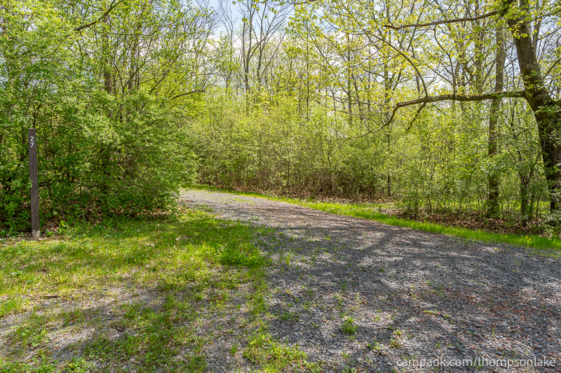 Campsite Photo of Site 27 at Thompsons Lake Campground, New York - Looking at Site from Road Sign Visible