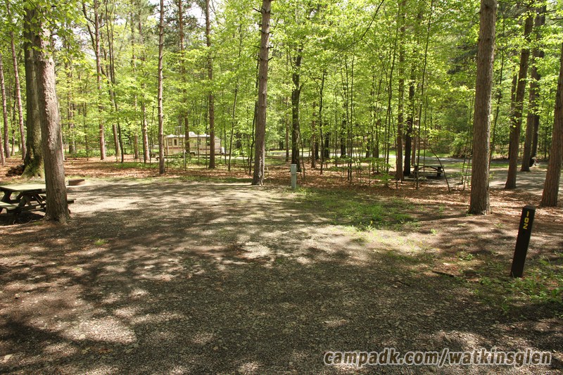 Campsite Photo of Site 102 at Watkins Glen State Park, New York - Looking at Site from Road Sign Visible