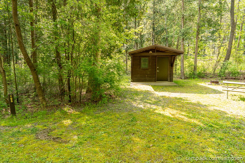 Campsite Photo of Site 106 at Watkins Glen State Park, New York - Looking at Site from Road Sign Visible
