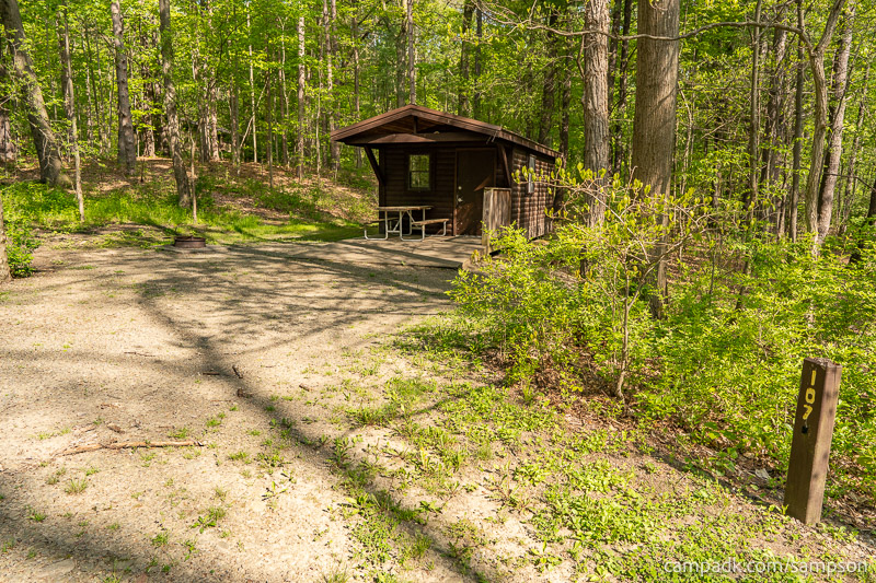 Campsite Photo of Site 107 at Watkins Glen State Park, New York - Looking at Site from Road Sign Visible