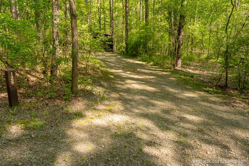 Campsite Photo of Site 125 at Watkins Glen State Park, New York - Looking at Site from Road Sign Visible
