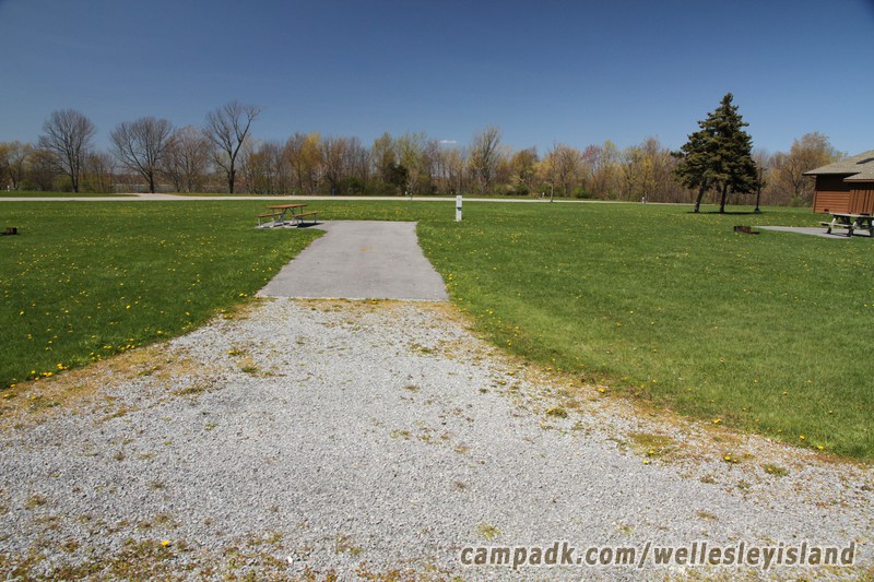 Campsite Photo of Site 13 at Wellesley Island State Park, New York - Looking at Site from Road Sign Visible