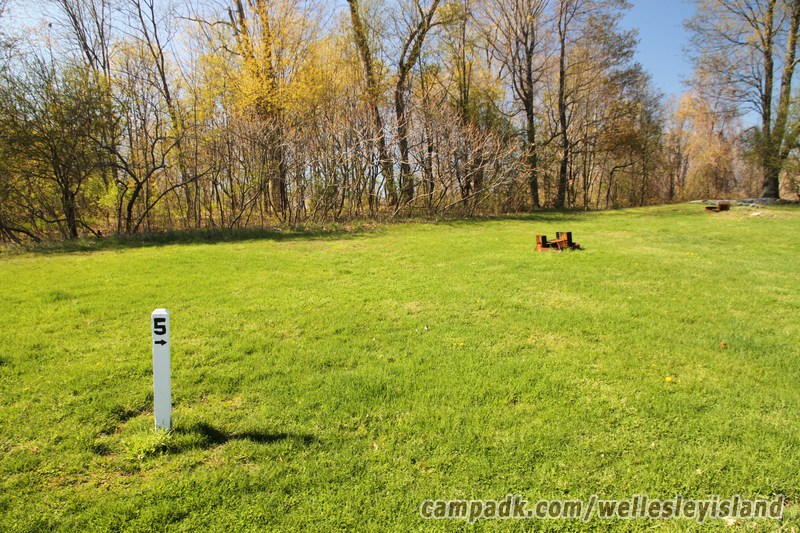 Campsite Photo of Site 5 at Wellesley Island State Park, New York - Looking at Site from Road Sign Visible