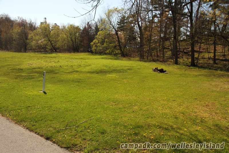 Campsite Photo of Site 25 at Wellesley Island State Park, New York - Looking at Site from Road Sign Visible