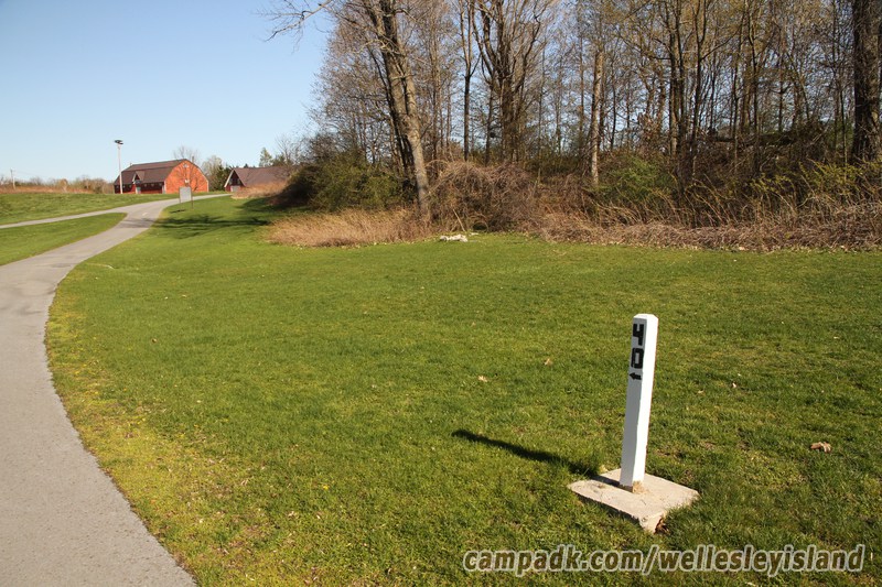 Campsite Photo of Site 40 at Wellesley Island State Park, New York - Looking at Site from Road Sign Visible