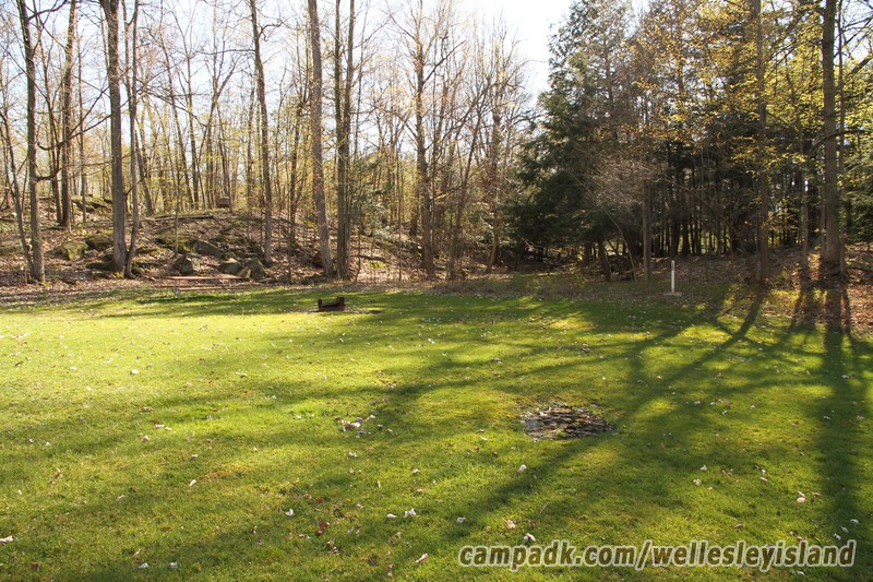 Campsite Photo of Site 12 at Wellesley Island State Park, New York - Looking at Site from Road Sign Visible