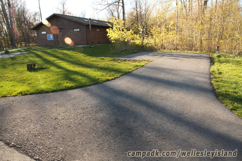 Campsite Photo of Site 9 at Wellesley Island State Park, New York - Looking at Site from Road Sign Visible