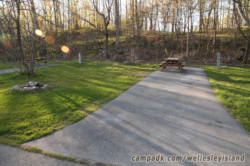 Campsite Photo of Site 34 at Wellesley Island State Park, New York - Looking at Site from Road Sign Visible