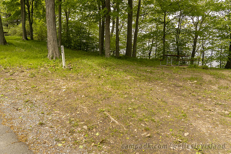 Campsite Photo of Site 20 at Wellesley Island State Park, New York - Looking at Site from Road Sign Visible